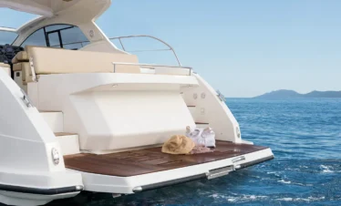 A private yacht trip in Sharm El Sheikh, with a luxury yacht sailing on the Red Sea at sunset.