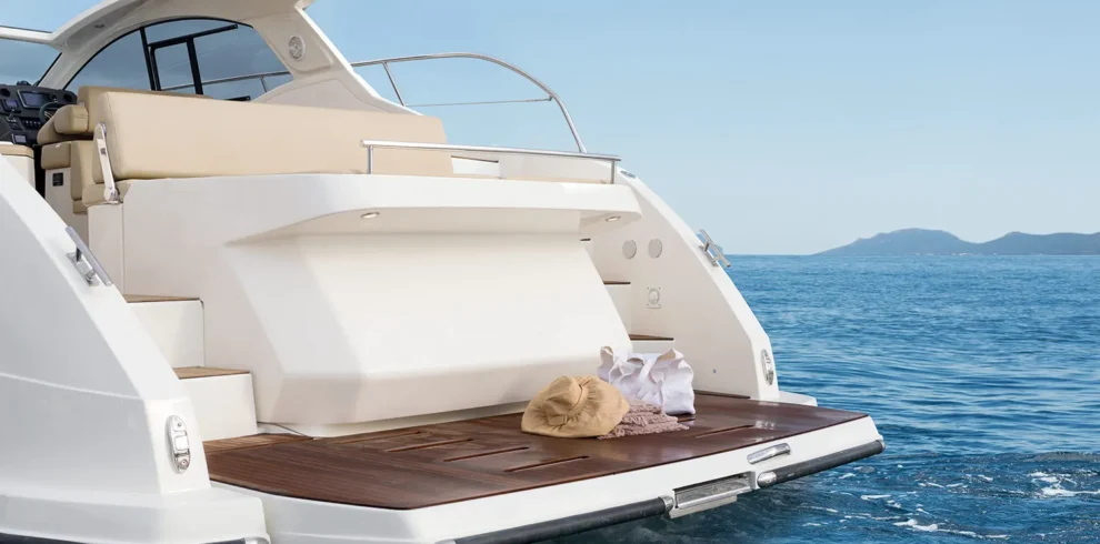 A private yacht trip in Sharm El Sheikh, with a luxury yacht sailing on the Red Sea at sunset.
