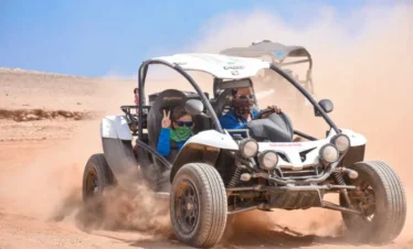 Guests riding Buggy Desert Adventure and enjoying Bedouin dinner with folklore show in Sharm El Sheikh desert