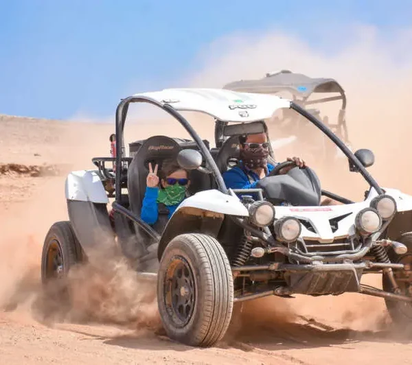 Guests riding Buggy Desert Adventure and enjoying Bedouin dinner with folklore show in Sharm El Sheikh desert