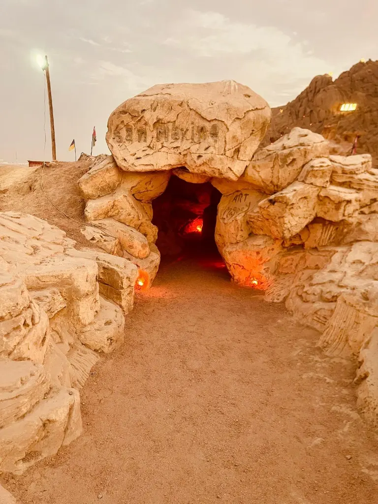 The illuminated rock entrance leading into the Bedouin camp in Sharm El Sheikh.
